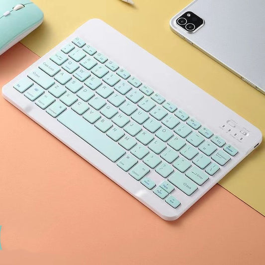 Mint green keyboard on a colorful background