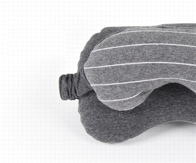 Gray sleep mask with white stripes on a white background