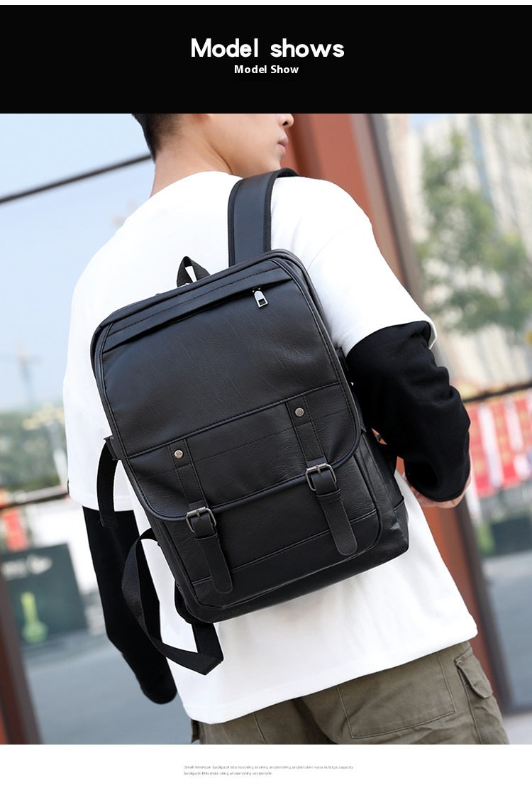 Person wearing a black backpack outdoors