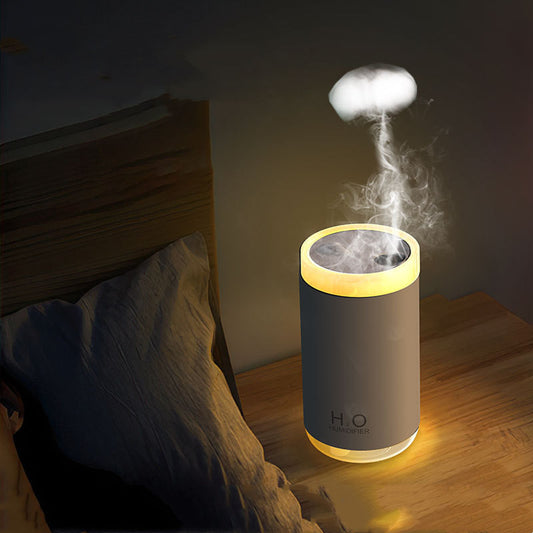 Humidifier emitting steam on a wooden surface with a dark background