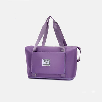 Purple tote bag with a visible brand logo on a white background