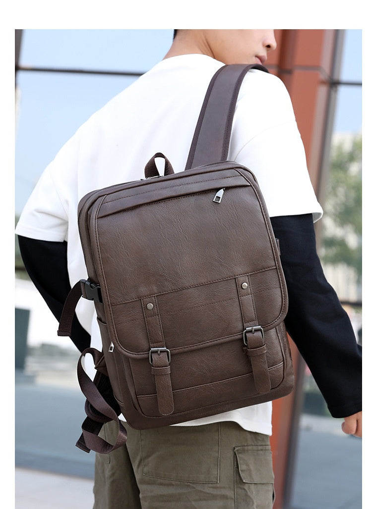 Person wearing a brown backpack outdoors