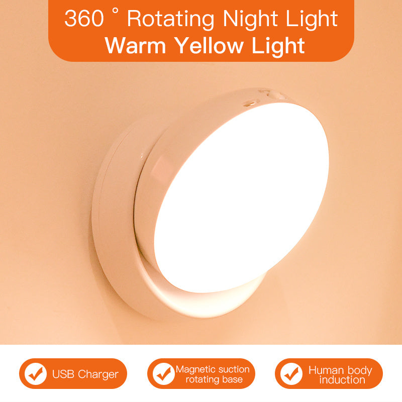 360-degree rotating night light with warm yellow light on a peach background