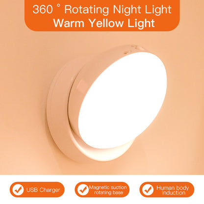 360-degree rotating night light with warm yellow light on a peach background