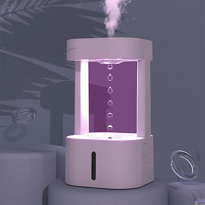 White humidifier emitting mist on a dark background