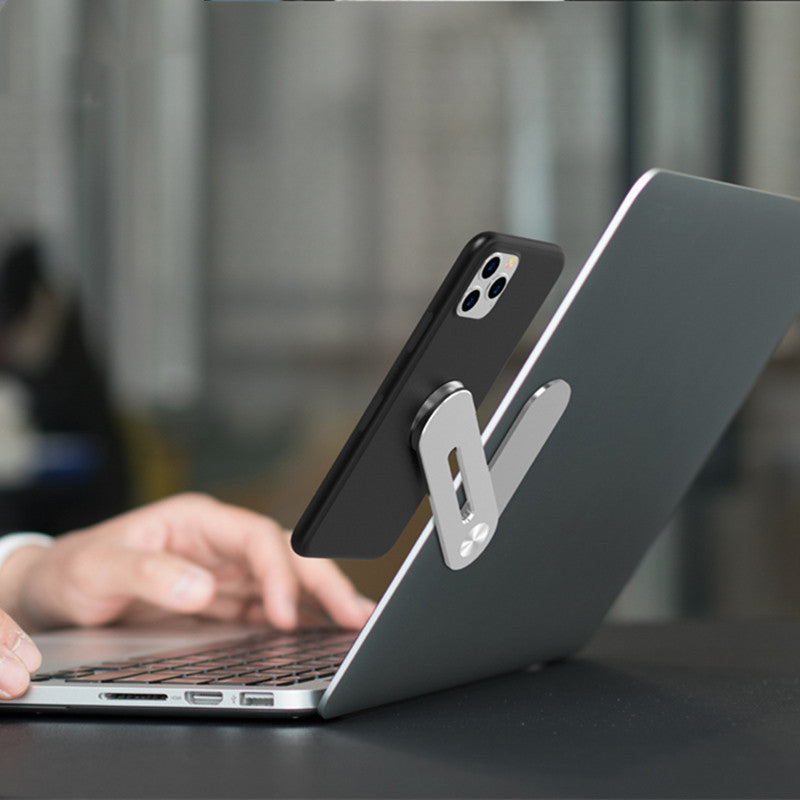 Phone stand on a laptop with blurred background