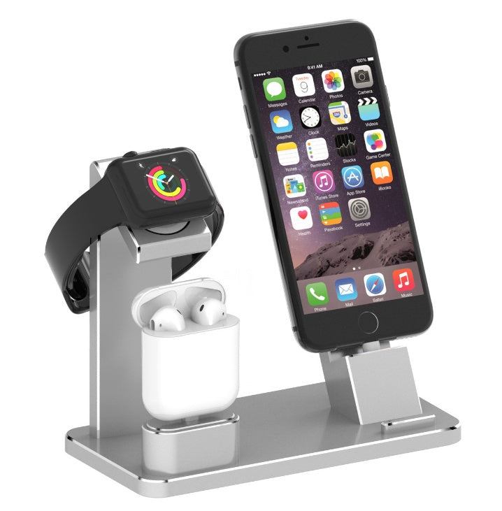 Multi-device charging stand with smartphone, smartwatch, and wireless earbuds on a white background