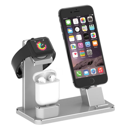Multi-device charging stand with smartphone, smartwatch, and wireless earbuds on a white background