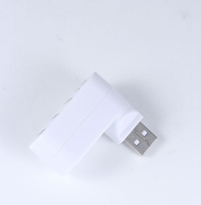 White USB drive on a light gray background