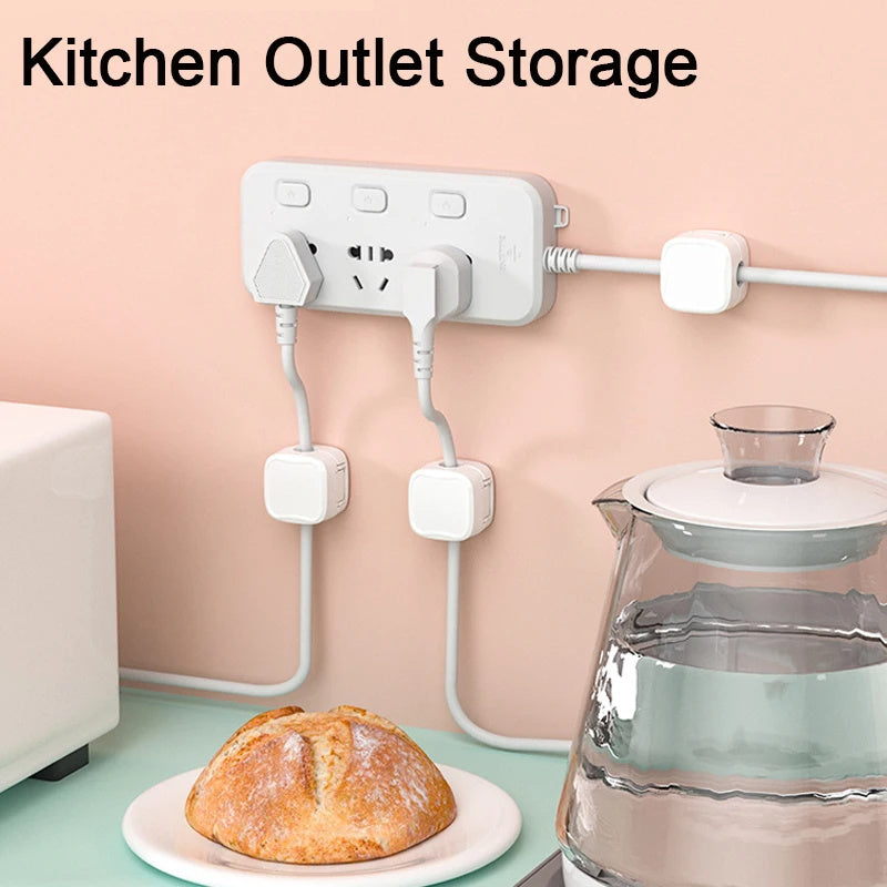 Kitchen outlet storage solution with multiple outlets and plugs, bread on a plate, and a glass container on a countertop.