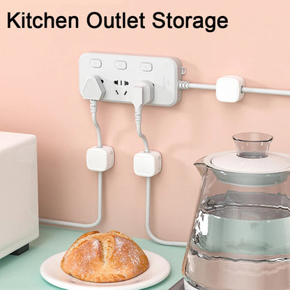 Kitchen outlet storage solution with multiple outlets and plugs, bread on a plate, and a glass container on a countertop.
