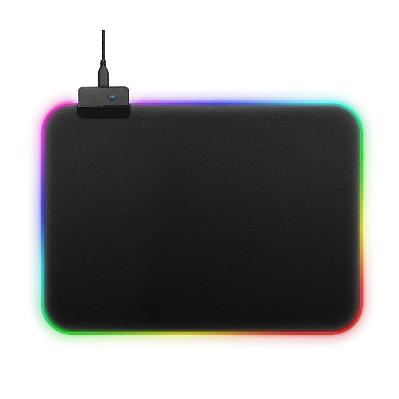 Black mouse pad with colorful LED lighting on a white background