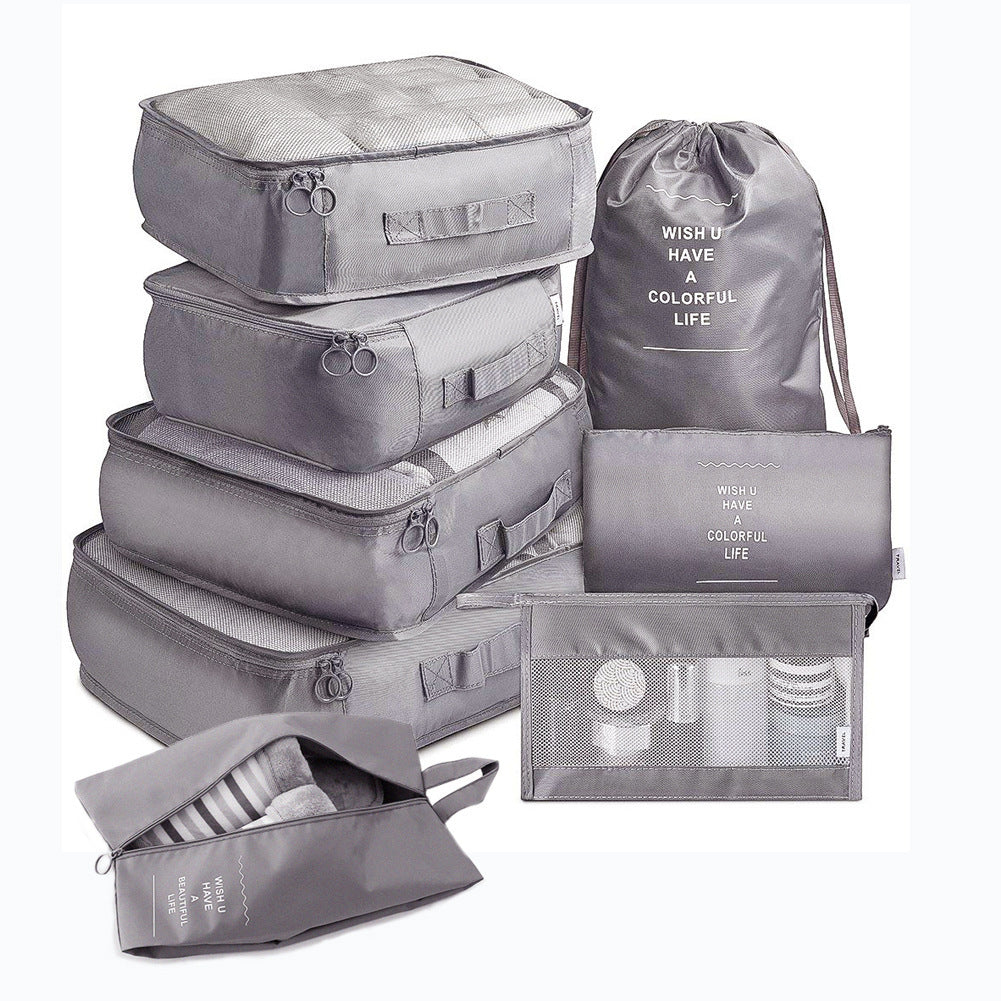Set of gray packing cubes and bags on a white background