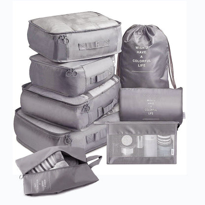 Set of gray packing cubes and bags on a white background