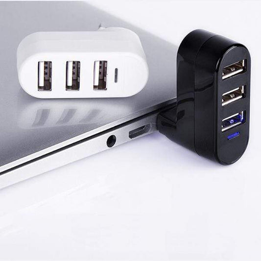 Black USB hub attached to a laptop on a white background