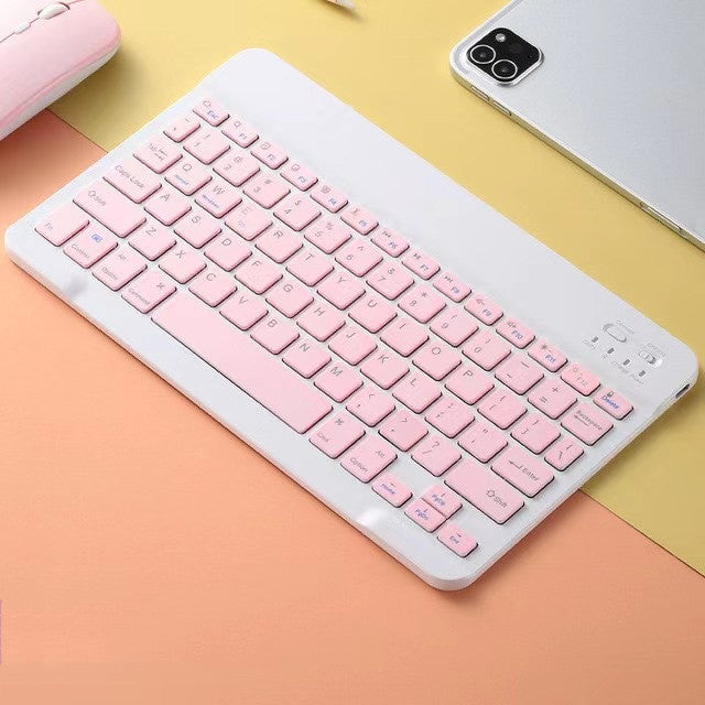 Pink keyboard on a colorful background