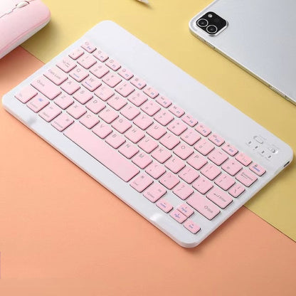 Pink keyboard on a colorful background