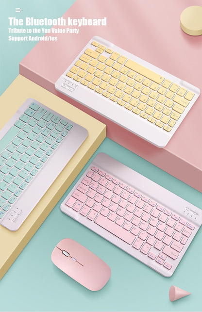 Set of colorful wireless keyboards and a mouse on a pastel background