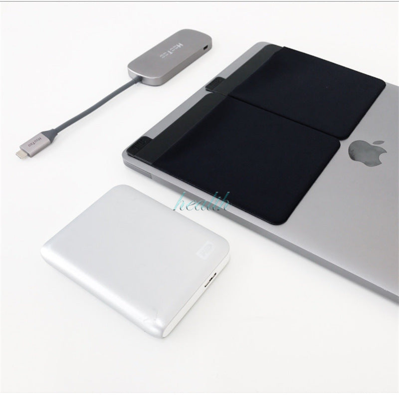 Small electronic device with cable on a white surface