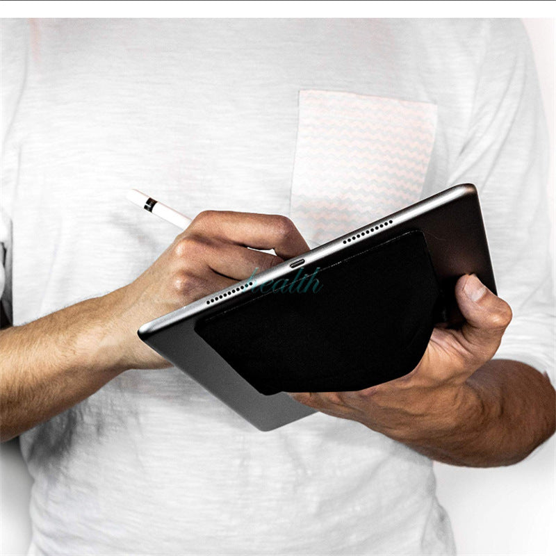 Person holding a tablet with a pen, wearing a white shirt