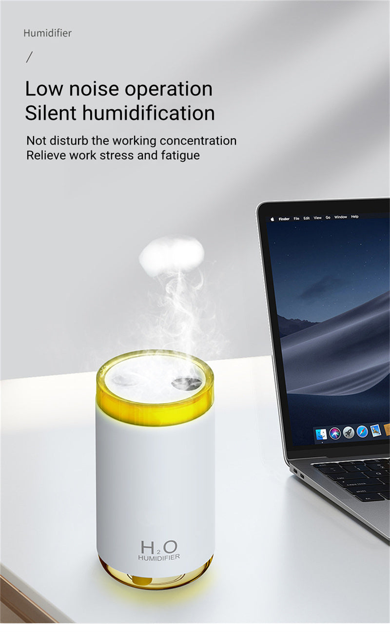 Humidifier on a desk with laptop, text about low noise operation and silent humidification.