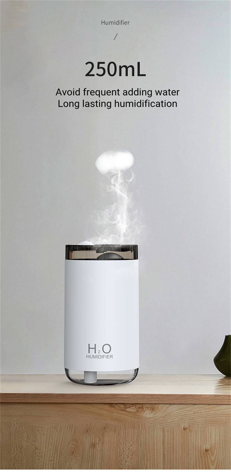 White humidifier with steam release on a wooden surface and light gray background