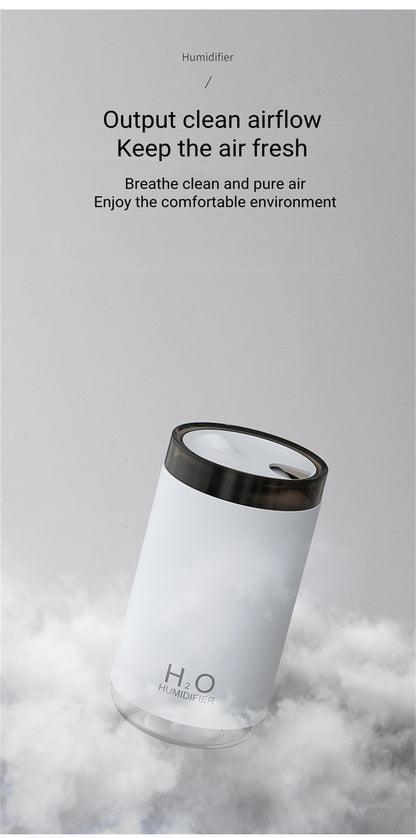 White humidifier with black top on a gray background with text about clean airflow and air freshness.