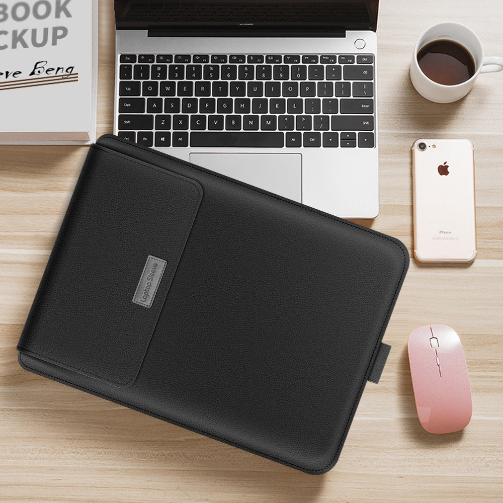 Black laptop sleeve on a desk with a laptop, phone, and mouse.
