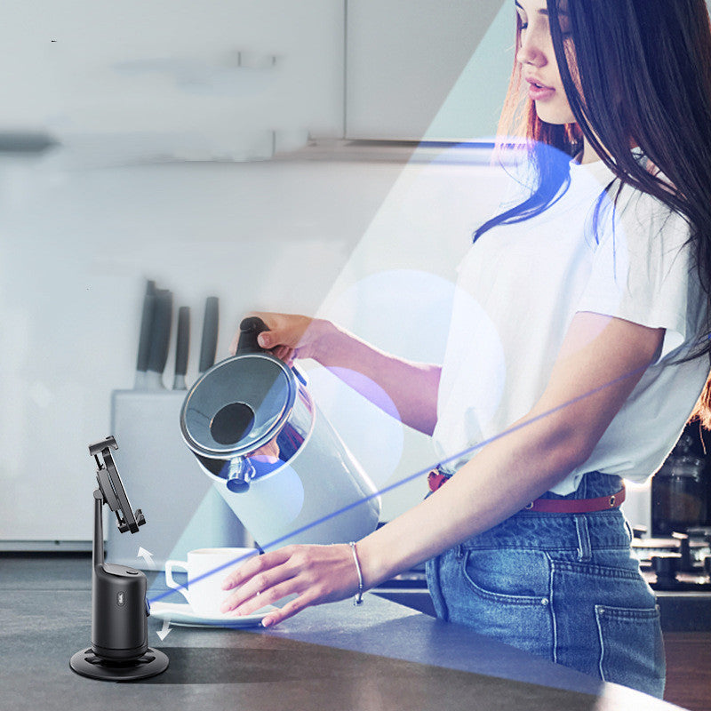 Woman using a kitchen appliance on a counter with a blurred background