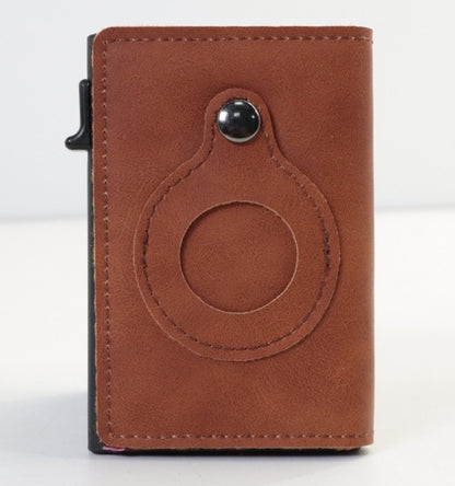 Brown leather cardholder with circular design on a white background