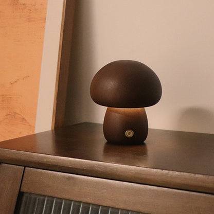 Mushroom-shaped lamp on a wooden surface with a neutral background