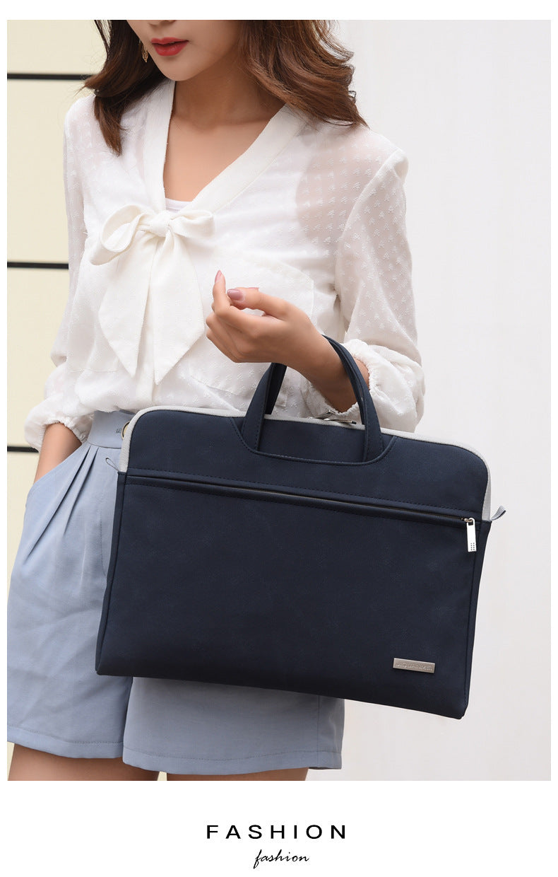 Woman holding a navy blue briefcase against a white background