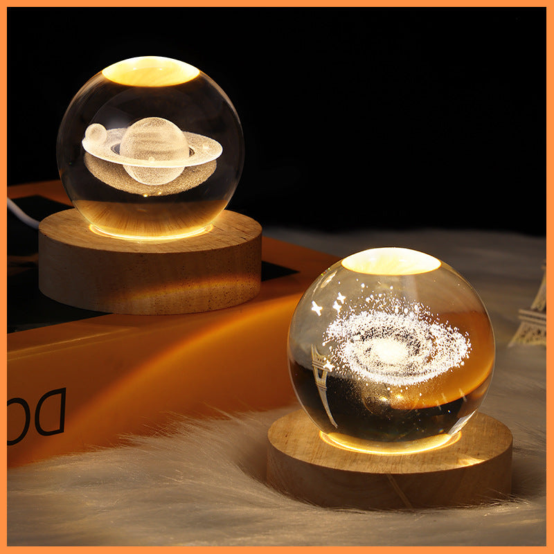 Two glass sphere lamps on wooden bases with a dark background