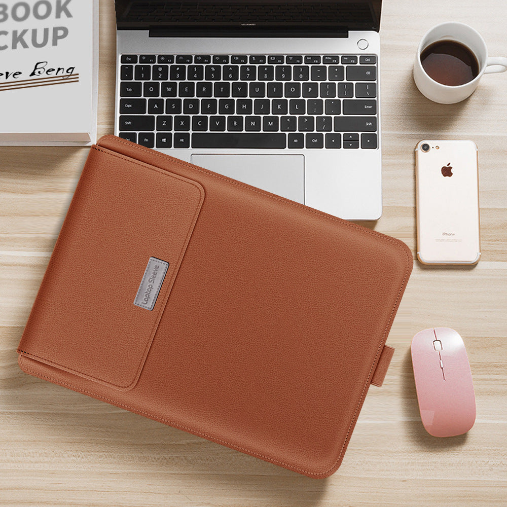 Brown laptop sleeve on a desk with a laptop, phone, and mouse.