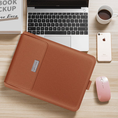 Brown laptop sleeve on a desk with a laptop, phone, and mouse.