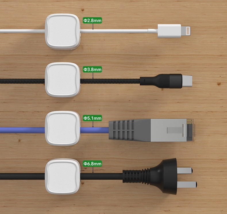 Set of different connectors with labeled diameters on a wooden surface