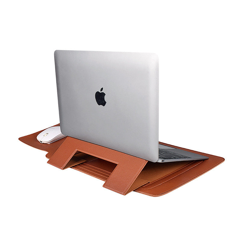 Laptop on a brown leather stand with a white background