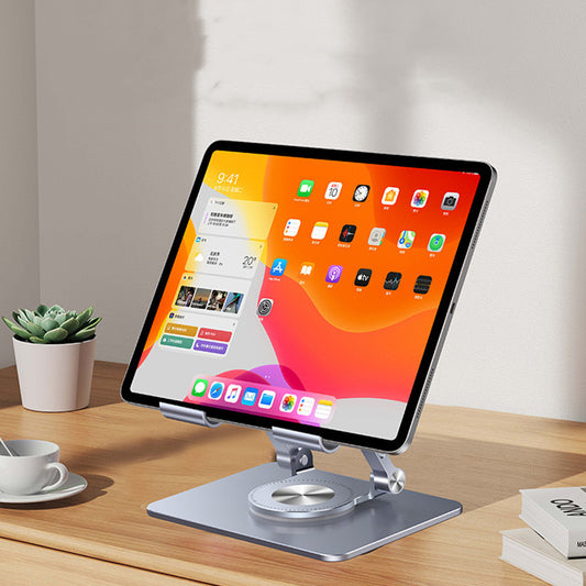 Tablet on a stand with a colorful display on a wooden desk