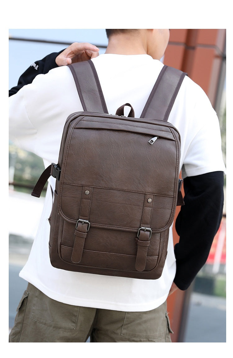 Person wearing a brown backpack outdoors
