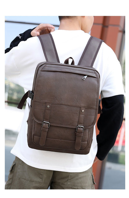 Person wearing a brown backpack outdoors