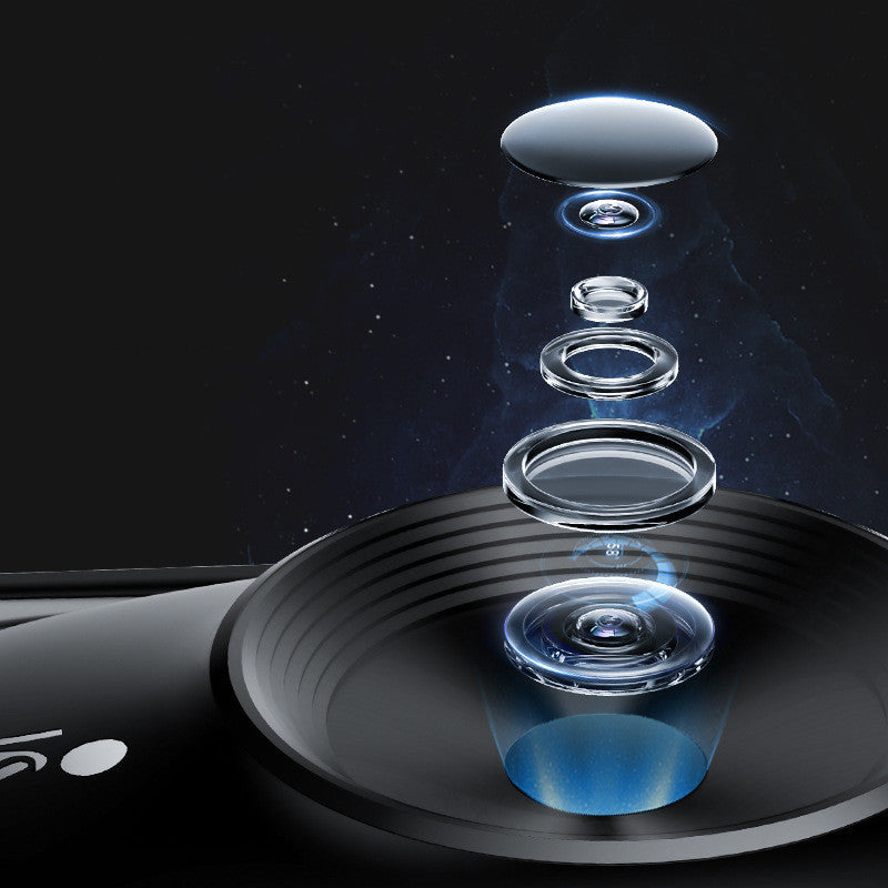 Transparent glass lenses stacked on a black surface with a dark background