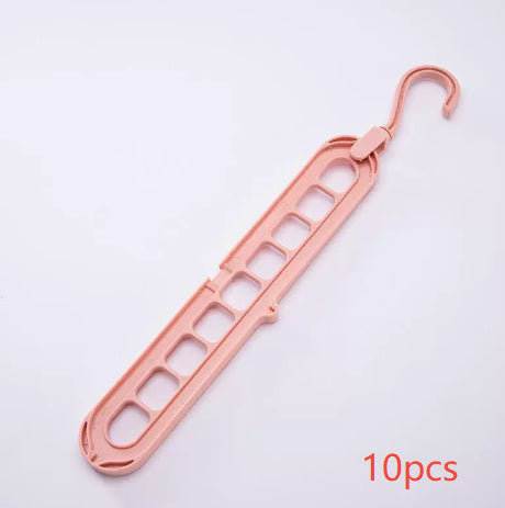 Rose gold plastic hanger on a white background with '10 pcs' text.