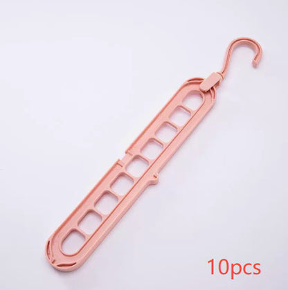 Rose gold plastic hanger on a white background with '10 pcs' text.