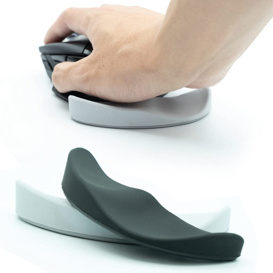 Hand using a computer mouse with a wrist rest on a white background