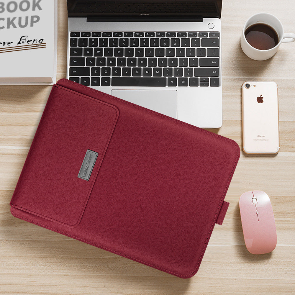 Red laptop sleeve on a desk with a laptop, phone, and mouse.