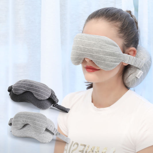 Woman wearing a gray sleep mask with additional masks displayed below on a light blue background