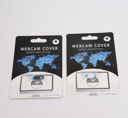 Two packages of webcam covers with world map design on a light gray background