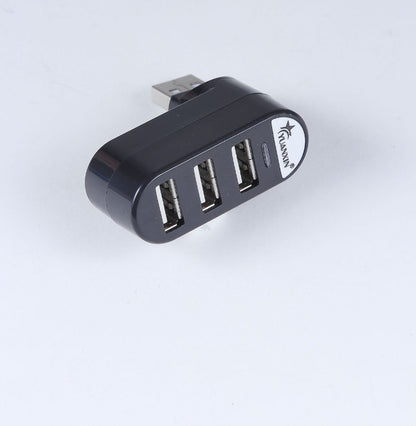 Black USB hub with four ports on a white background