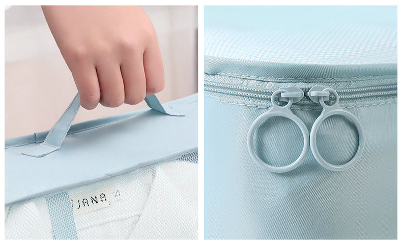 Light blue mesh bag with zipper and handle, featuring the brand 'Jana'.