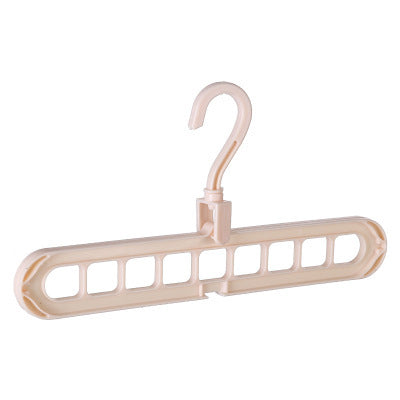 Beige plastic hanger with multiple hooks on a white background